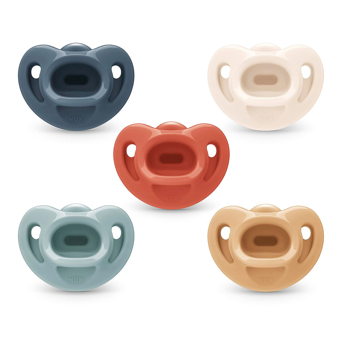 Five neutral assorted NUK Comfy pacifiers for babies ages zero to six months